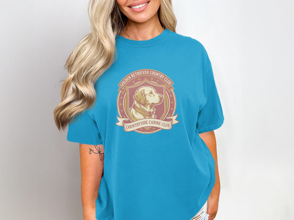Turquoise t-shirt with a Golden Retriever Country Club logo.