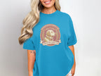 Turquoise t-shirt with a Golden Retriever Country Club logo.