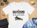White t-shirt with "My Dachshund is My Therapist He Charges in Treats" text and illustration.