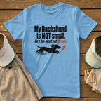 Light blue t-shirt with text "My Dachshund is NOT small. He's fun-sized and furious" and dog graphic.