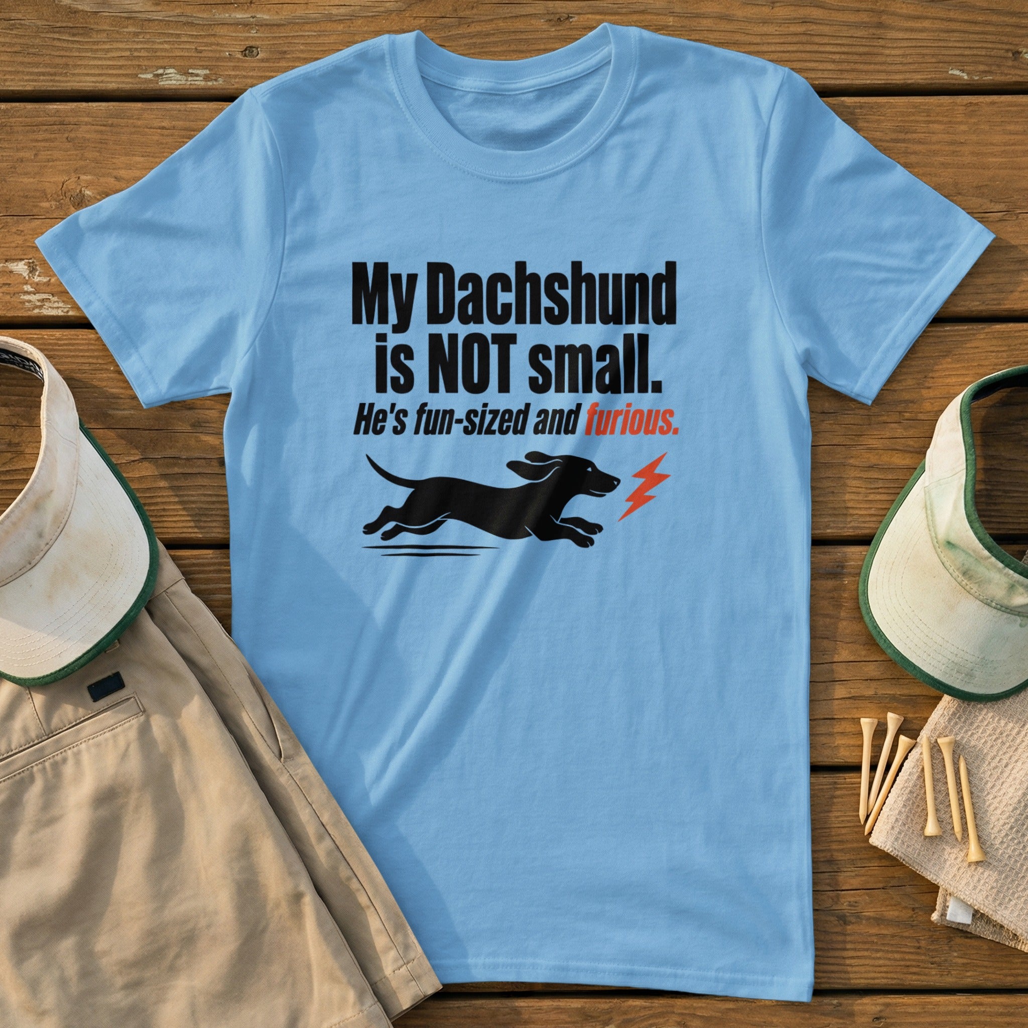 Light blue t-shirt with text "My Dachshund is NOT small. He's fun-sized and furious" and dog graphic.