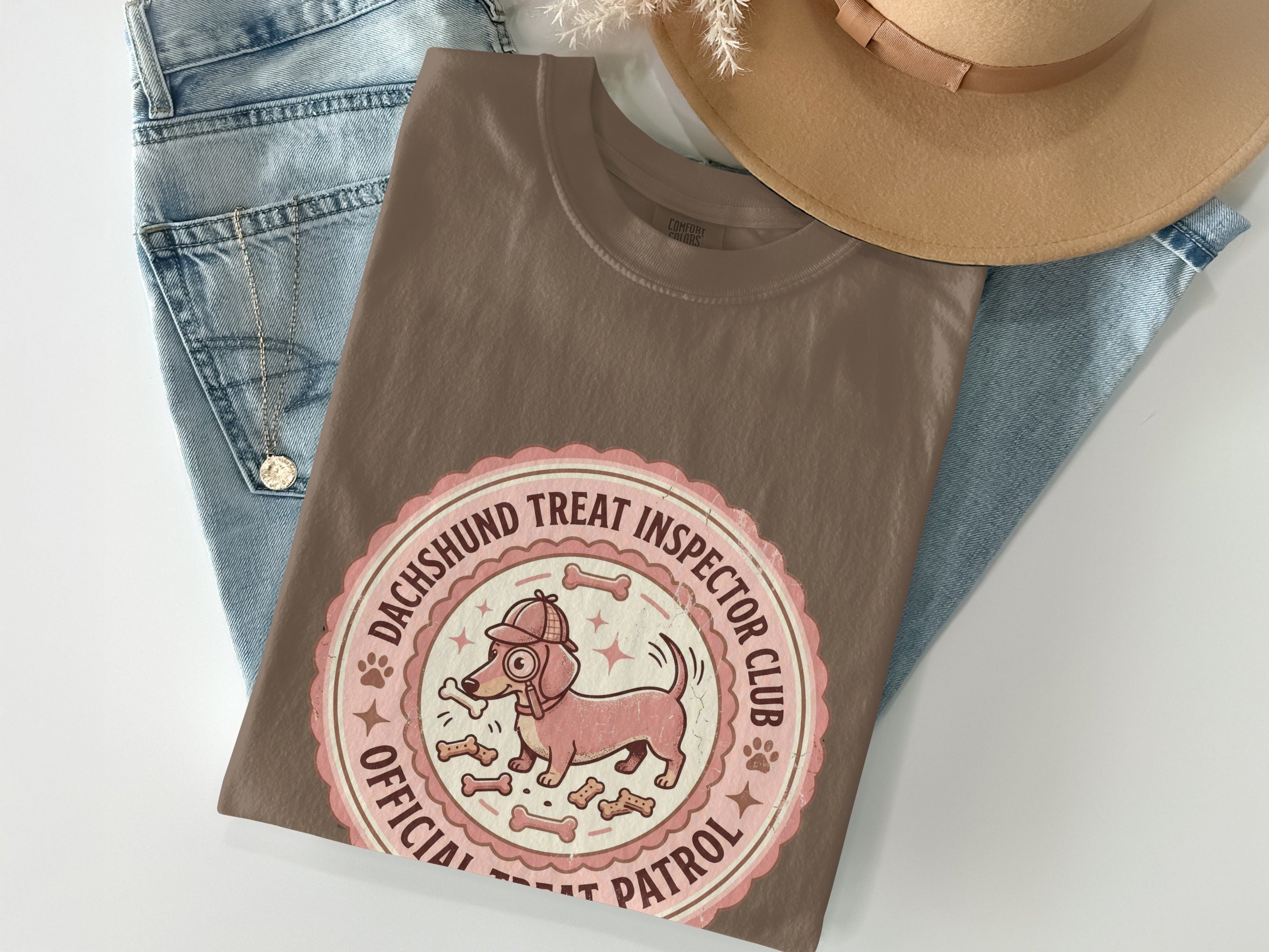 Brown t-shirt with "Dachshund Treat Inspector Club" seal and cartoon dog.