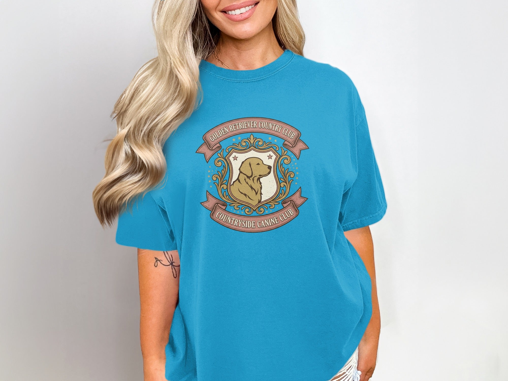 Turquoise t-shirt with Golden Retriever Country Club crest design.