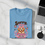 Blue t-shirt with a cartoon dog, pink bow, and text "Sorry, I Have Plans With My Dog."