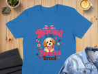 Blue t-shirt with "Rescued Is My Favorite Breed" text and a puppy graphic.