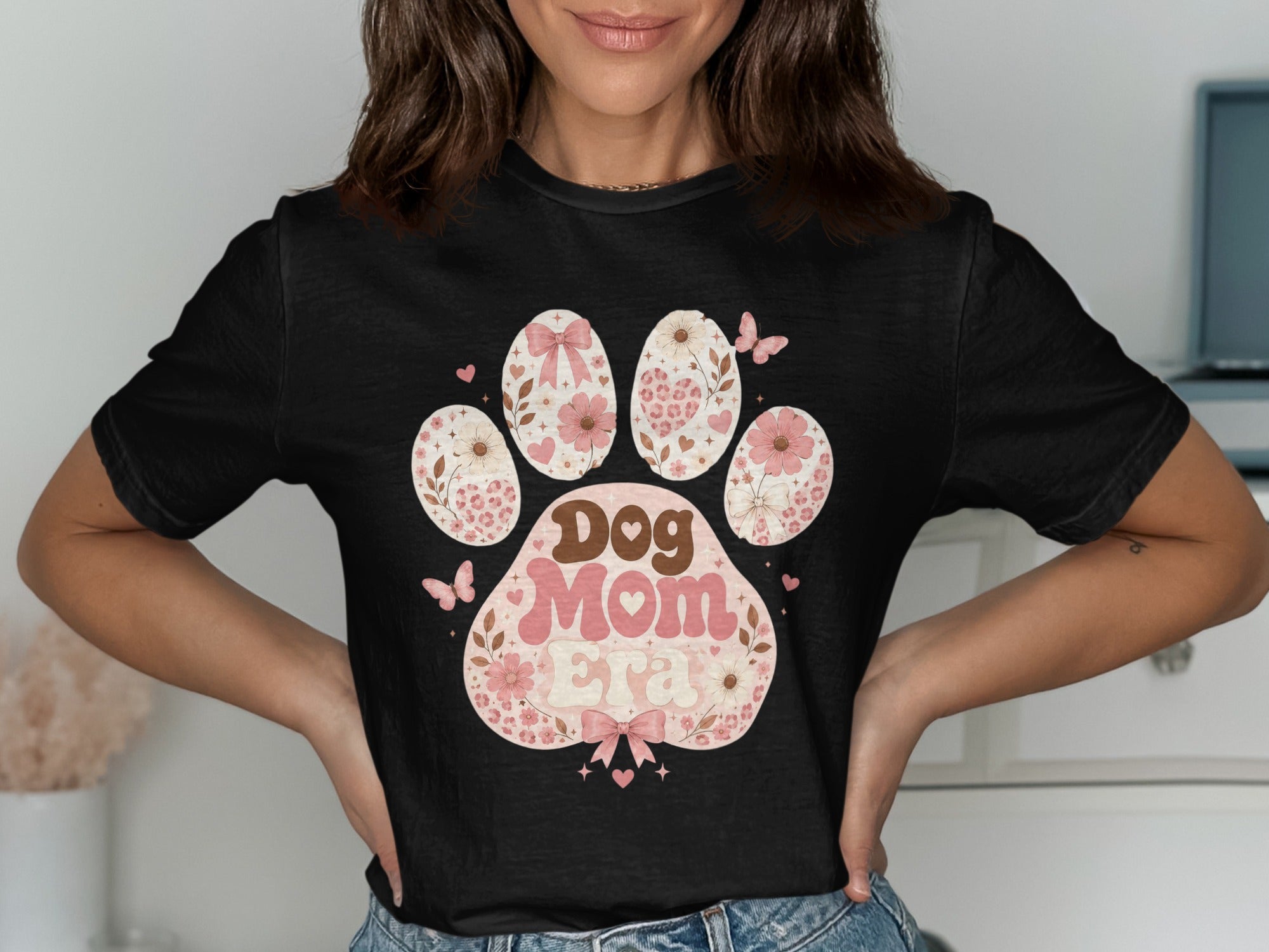 Black t-shirt with a paw print graphic featuring "Dog Mom Era" text.