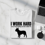 White t-shirt with black text "I WORK HARD" and a French Bulldog silhouette.