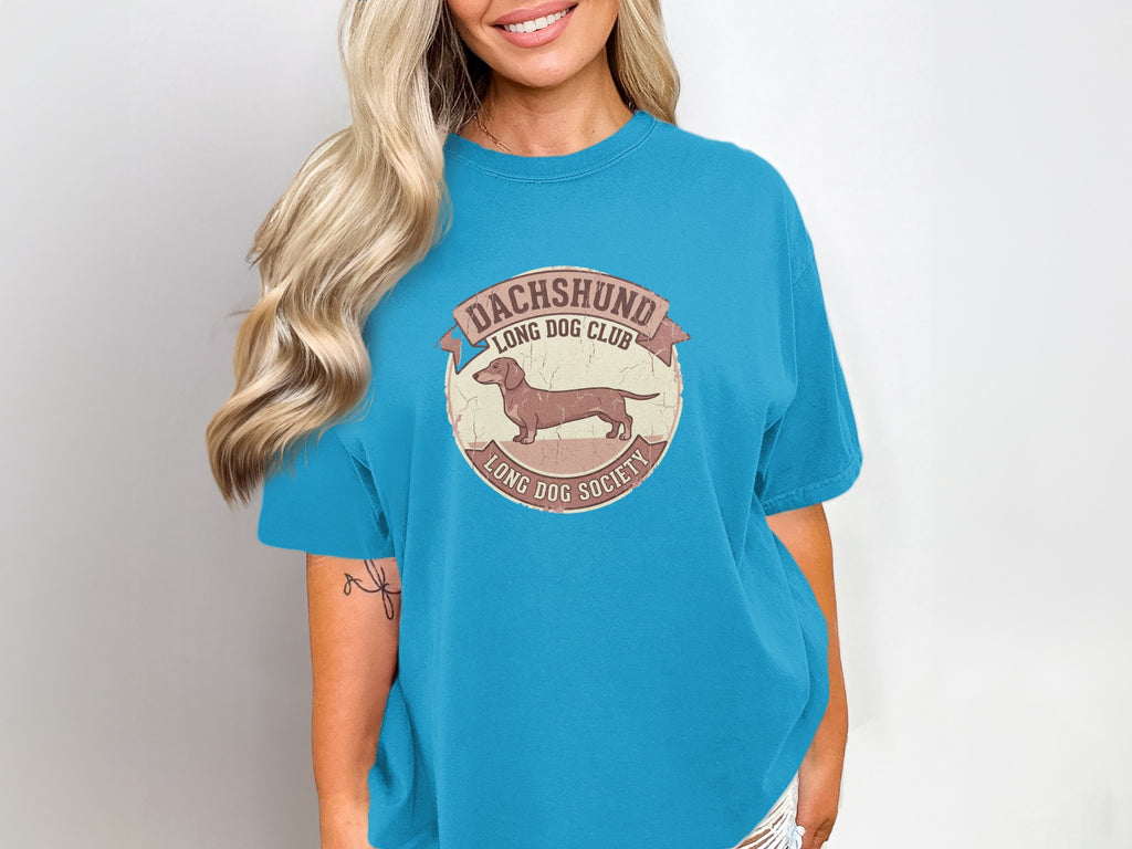 Teal t-shirt with distressed Dachshund Long Dog Club graphic.