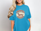 Teal t-shirt with distressed Dachshund Long Dog Club graphic.
