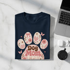 Navy t-shirt with retro "Dog Mom Era" paw print graphic and floral details.