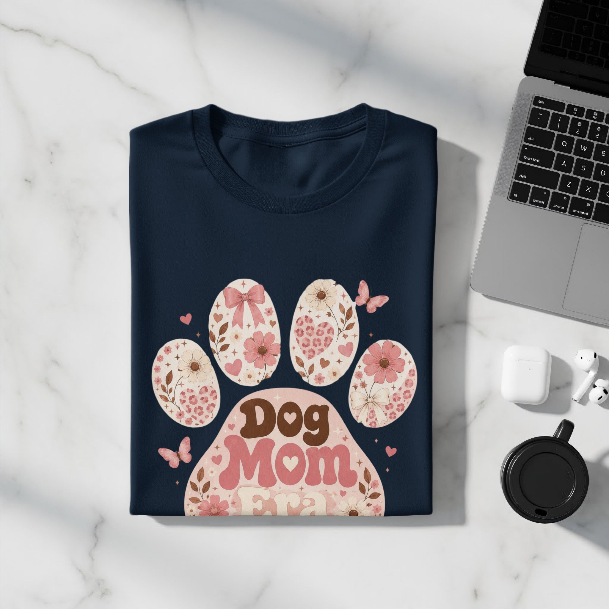 Navy t-shirt with retro "Dog Mom Era" paw print graphic and floral details.