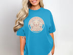 Teal t-shirt with Golden Retriever dog graphic and "Sunshine Pup Club" text.