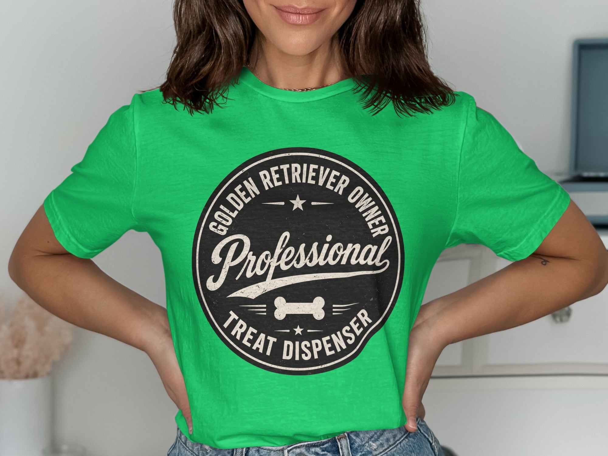 Green t-shirt with circular graphic: Professional Golden Retriever Owner Treat Dispenser.