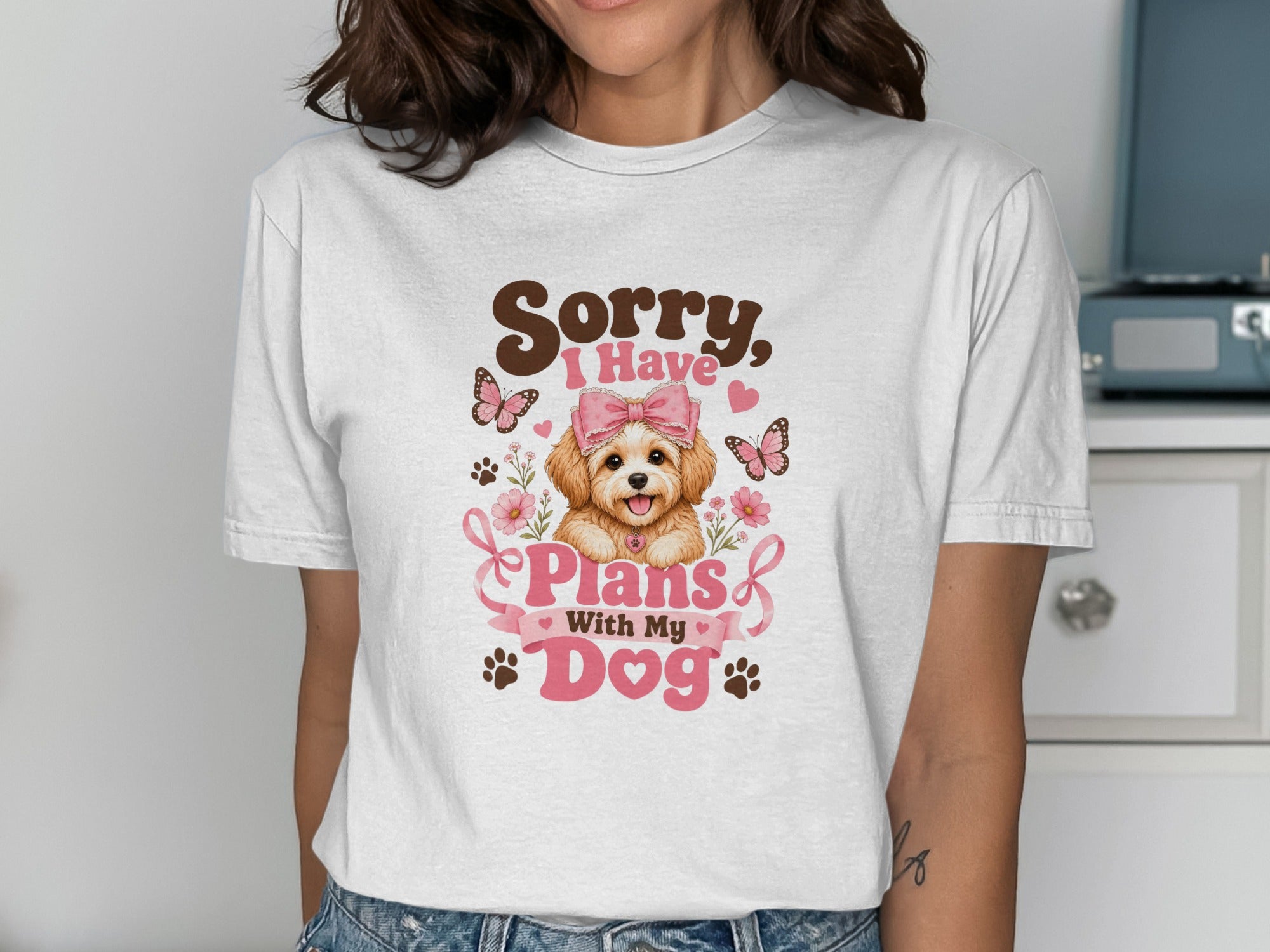 White t-shirt with "Sorry, I Have Plans With My Dog" and a cartoon dog.