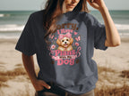 Dark grey t-shirt featuring a dog with a pink bow, text "Sorry, I Have Plans With My Dog".