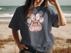 Dog Mom Era paw print design with flowers and butterflies.