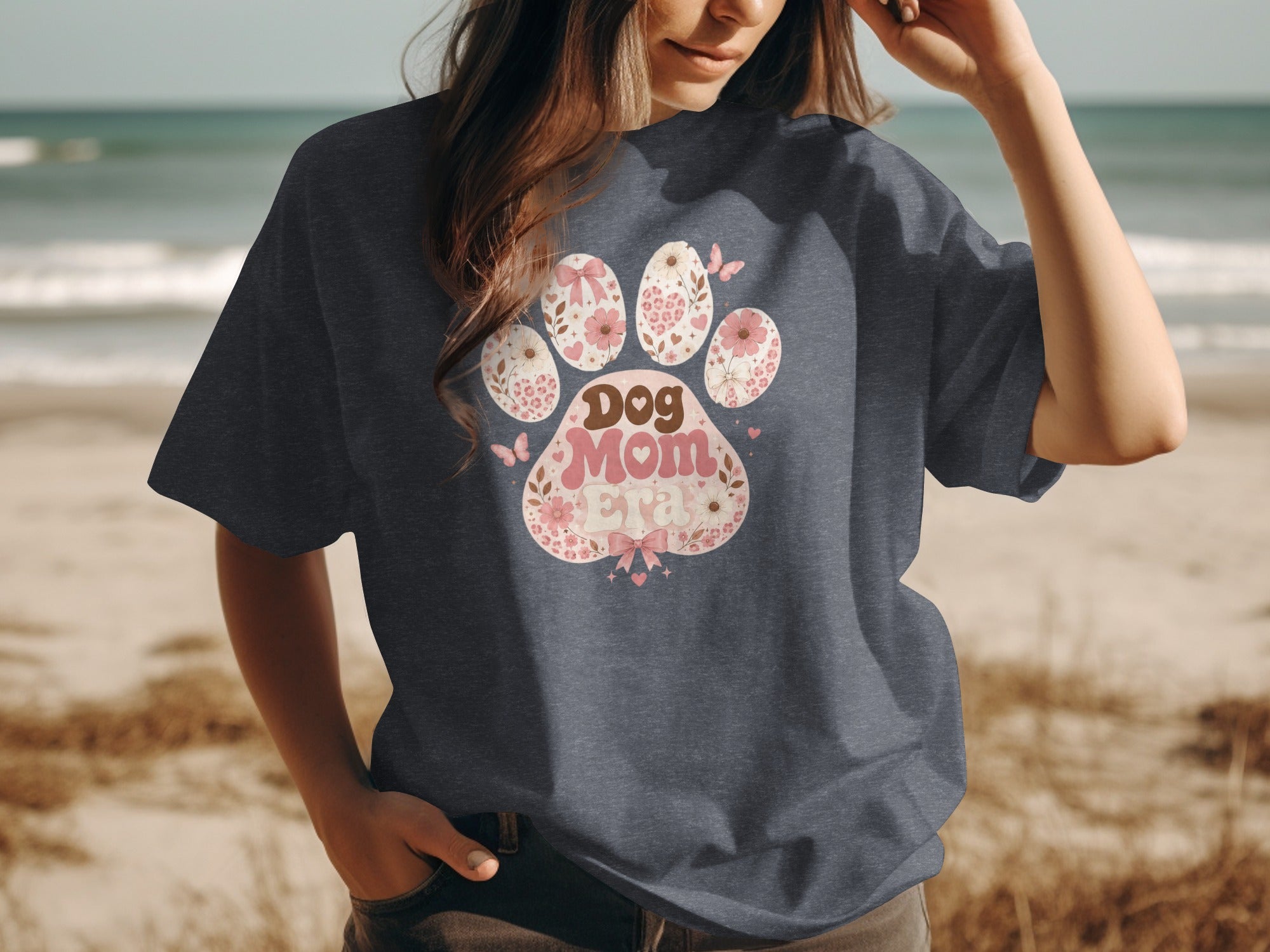 Dog Mom Era paw print design with flowers and butterflies.