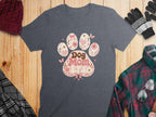 Dark grey t-shirt with a pink paw print design that reads “Dog Mom Era.”
