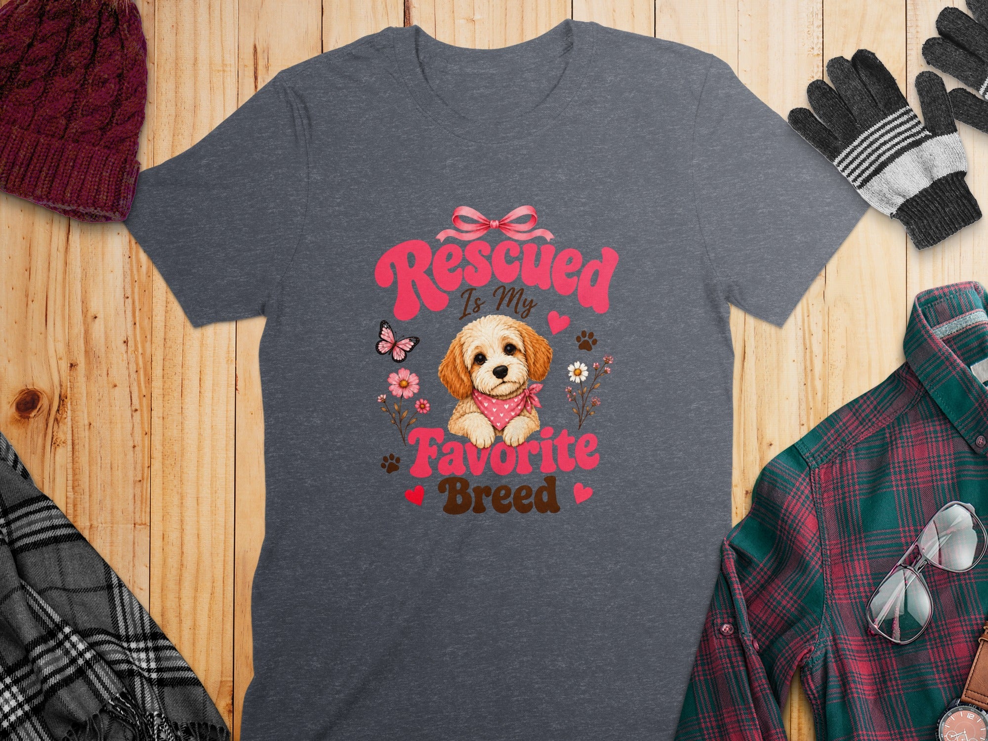 Dark gray t-shirt with a rescued dog design and text that reads "Rescued Is My Favorite Breed".