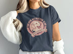 Dark t-shirt with Golden Retriever Club circular logo featuring a dog's head.
