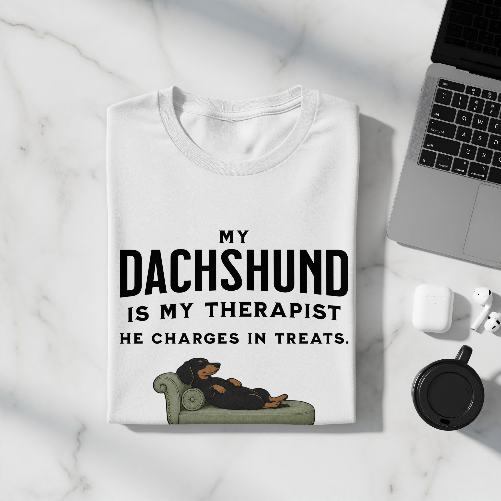White t-shirt with "My Dachshund is My Therapist He Charges in Treats" text and illustration.