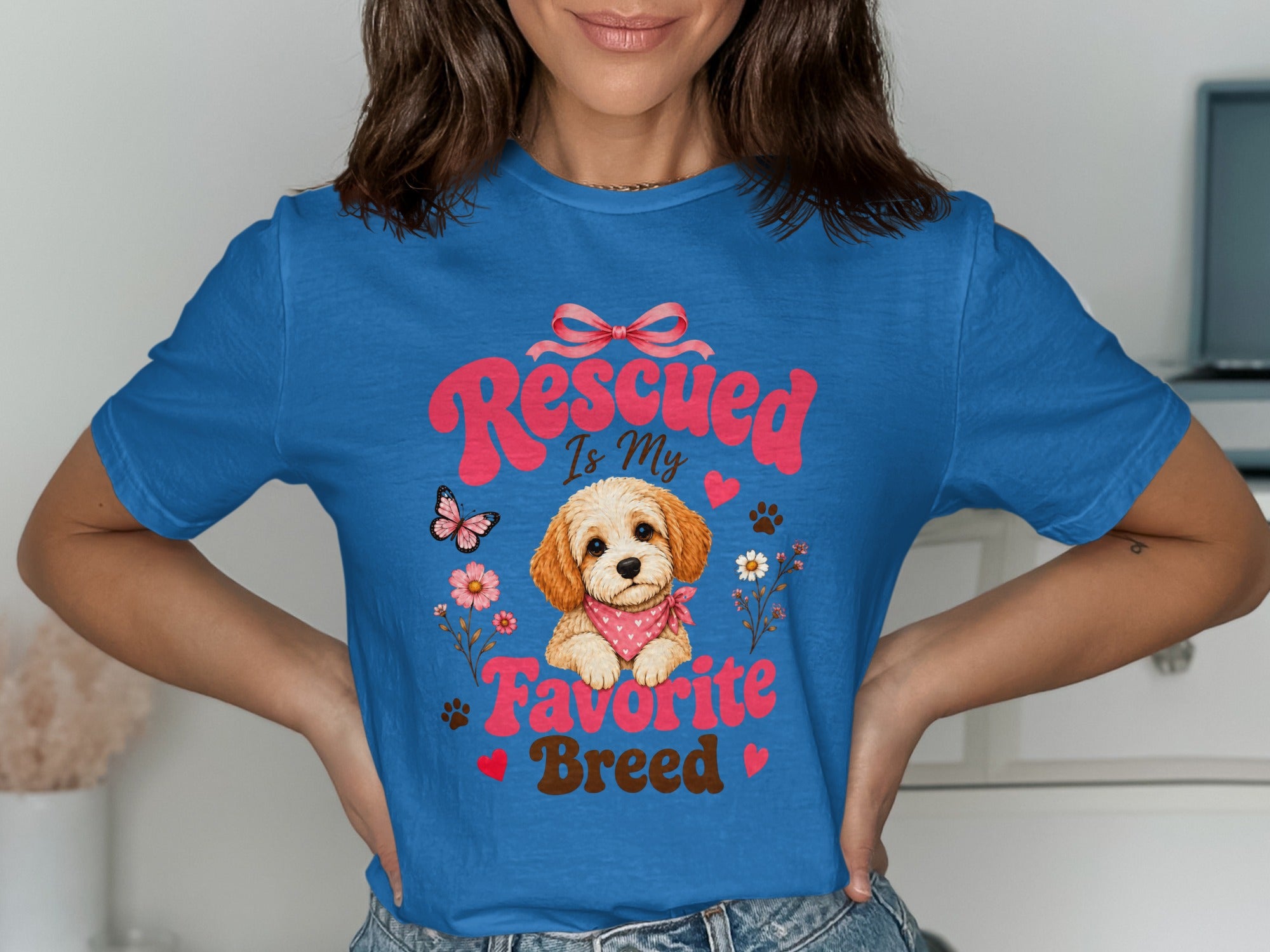 Blue t-shirt with "Rescued Is My Favorite Breed" text and a puppy graphic.