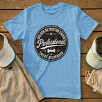 Light blue t-shirt with black circular design: "Golden Retriever Owner Professional Treat Dispenser".