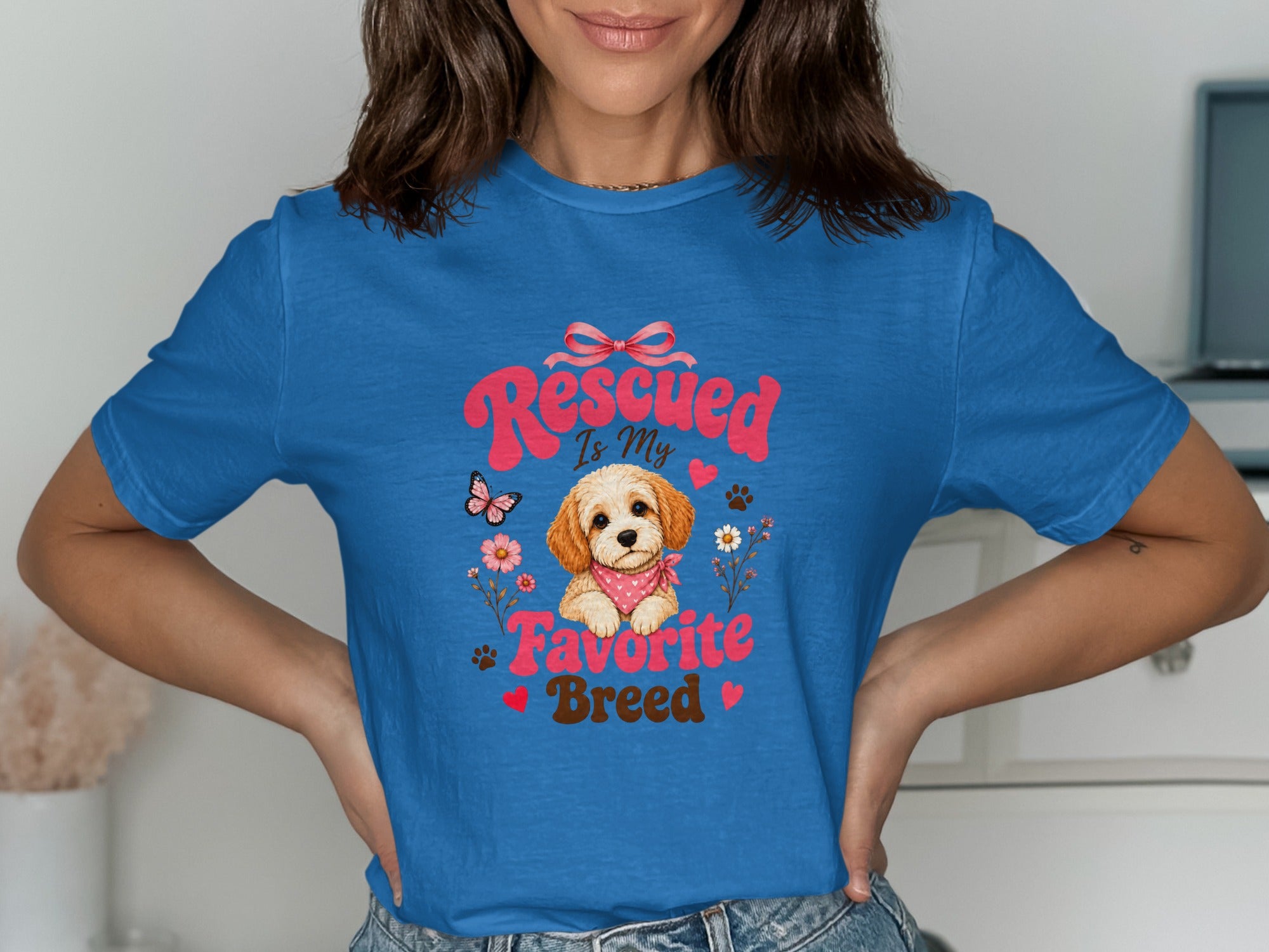 Blue t-shirt with "Rescued Is My Favorite Breed" text and a dog illustration.
