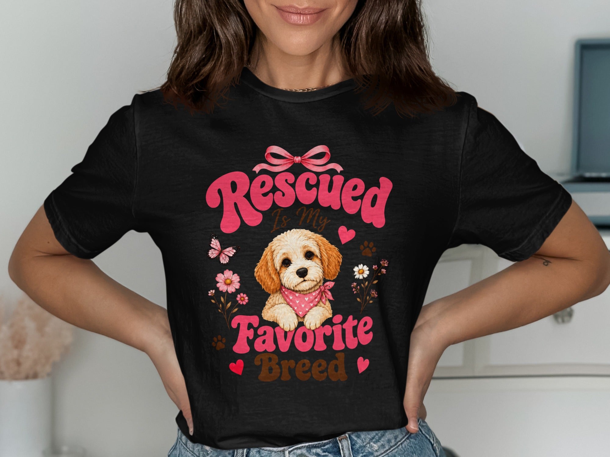 Black t-shirt graphic with a puppy and text "Rescued Is My Favorite Breed".
