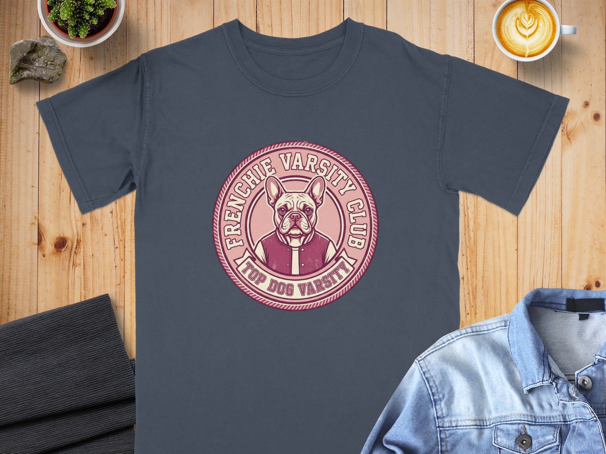 French Bulldog in a varsity jacket on a circular badge with "TOP DOG VARSITY CLUB" text.