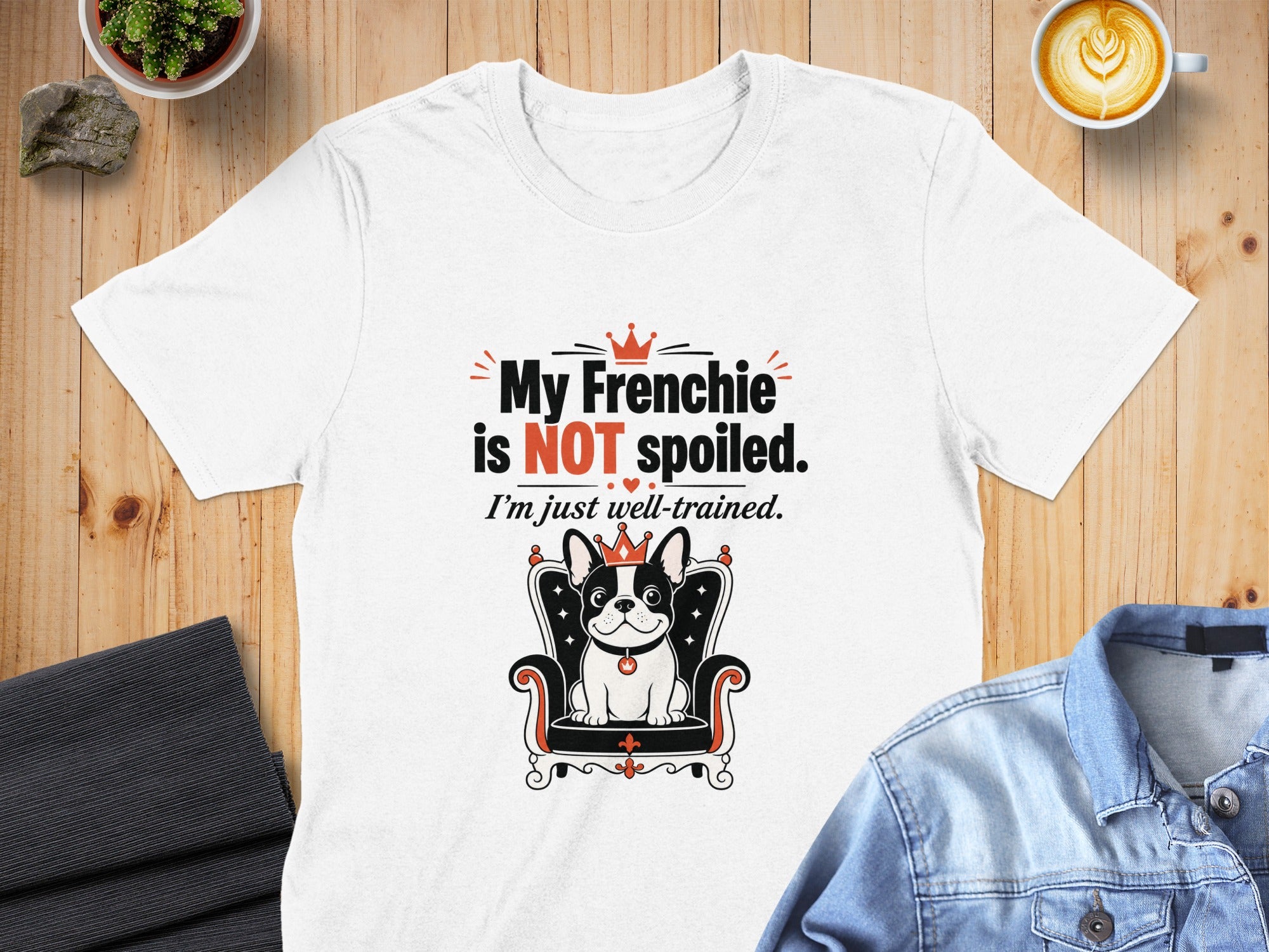 White t-shirt with text "My Frenchie is NOT spoiled. I'm just well-trained." and a French Bulldog graphic.