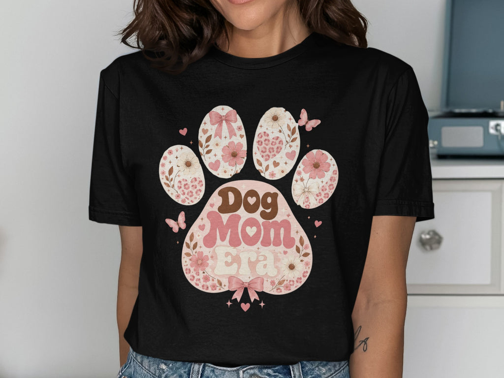 Black t-shirt with a paw print graphic that says "Dog Mom Era".