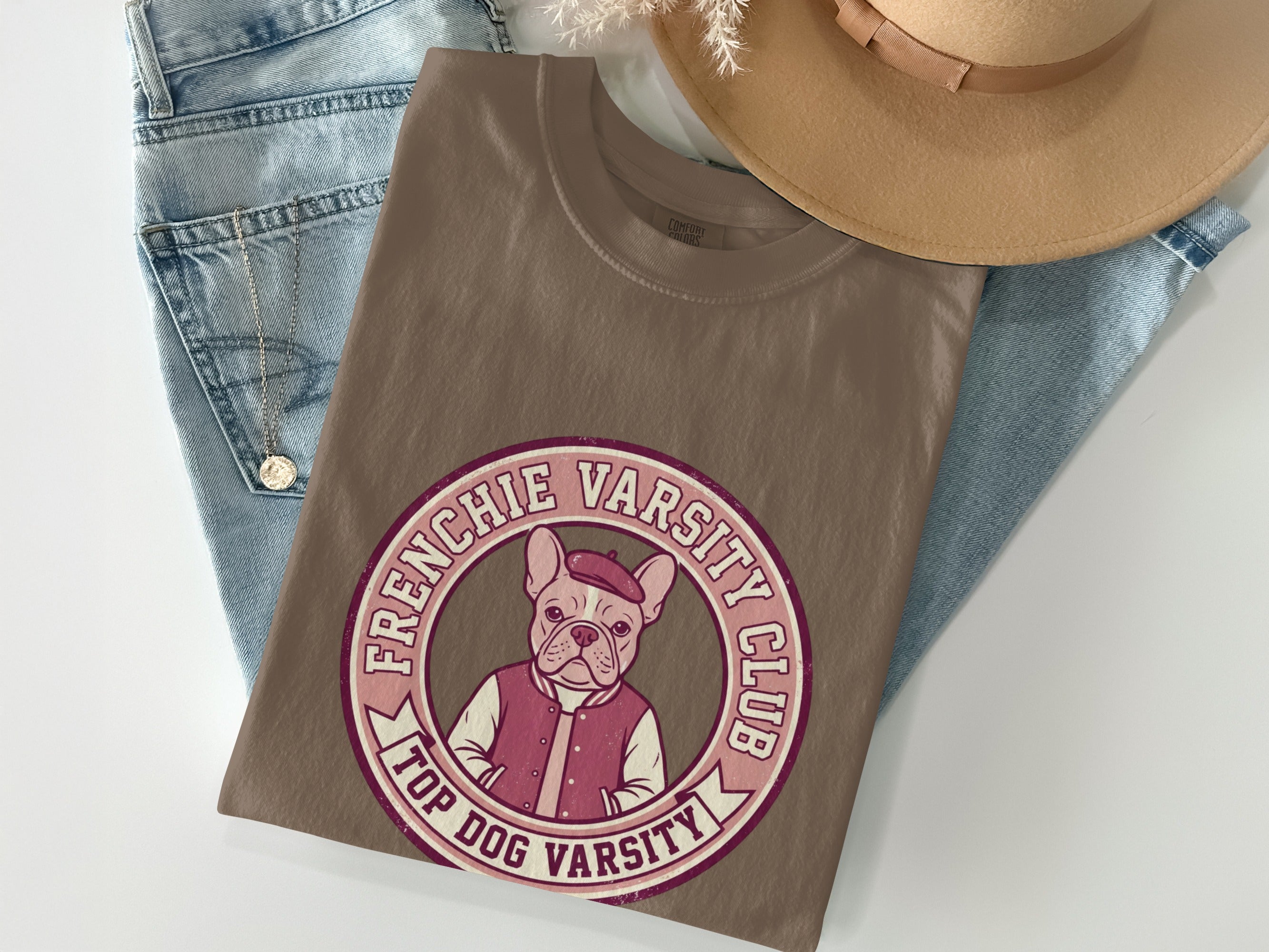 Brown t-shirt with French bulldog in varsity jacket, "Frenchie Varsity Club" text.