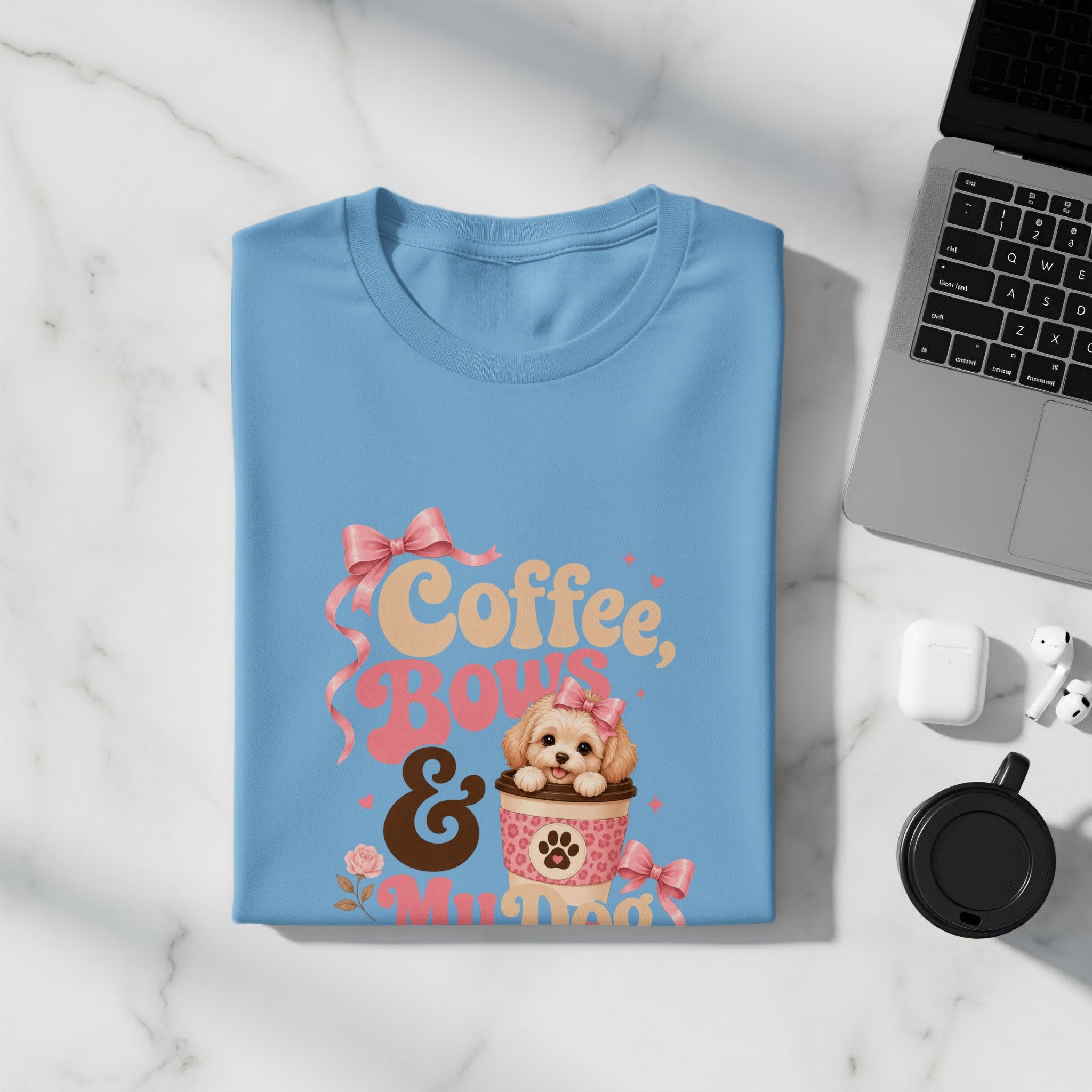 Light blue t-shirt with "Coffee, Bows & My Dog" graphic and pink ribbon.