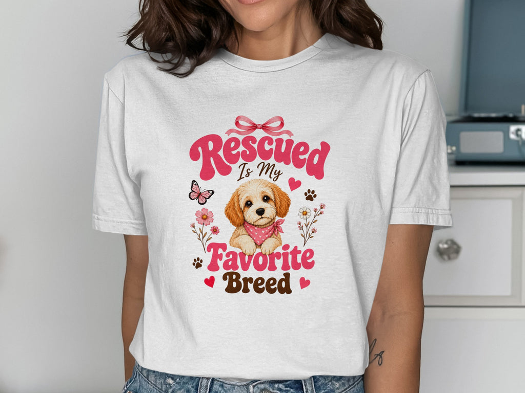 White t-shirt with "Rescued Is My Favorite Breed" text and puppy graphic.