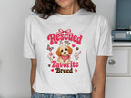 White t-shirt with "Rescued Is My Favorite Breed" text and puppy graphic.
