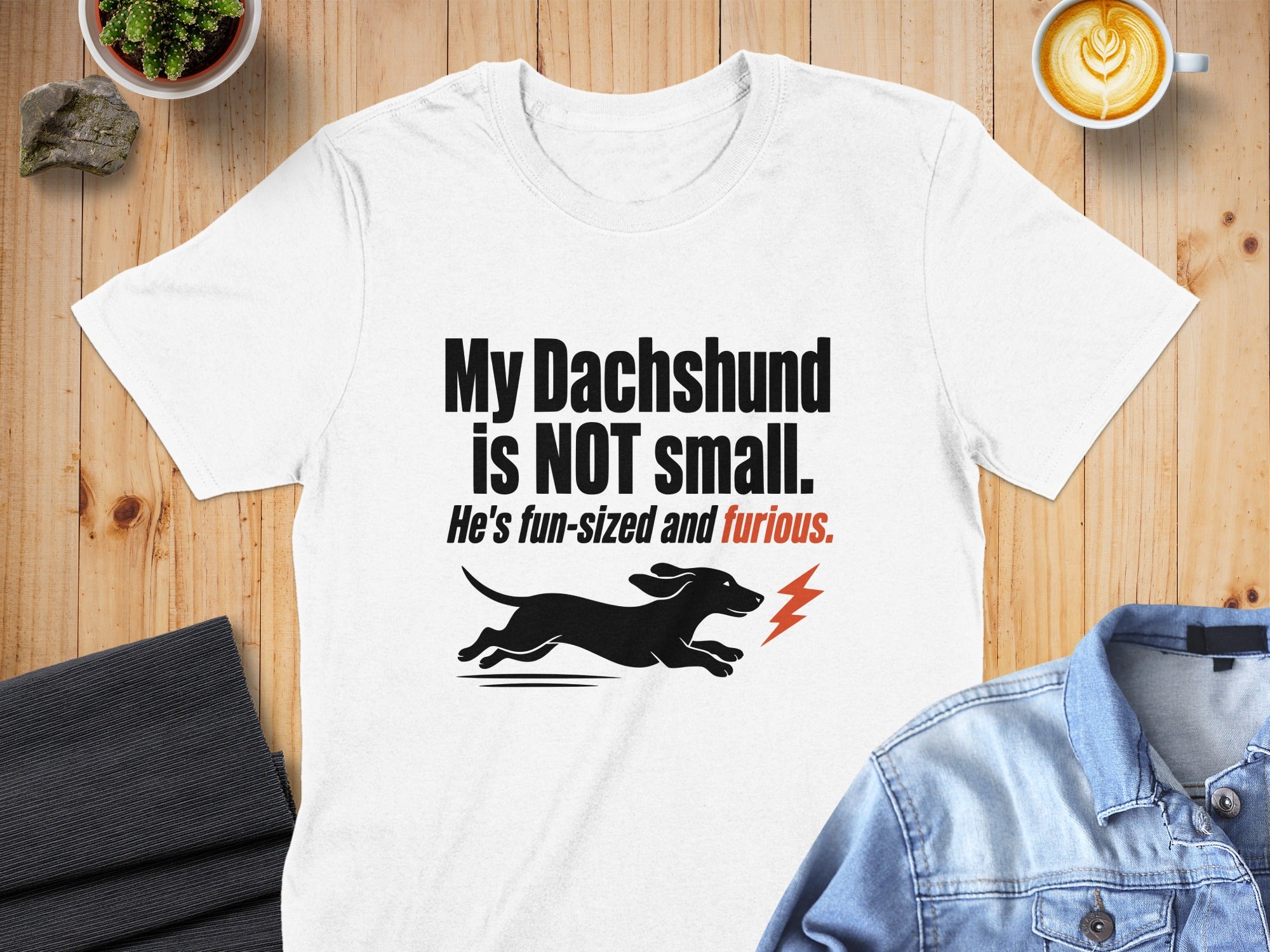 White t-shirt with "My Dachshund is NOT small. He's fun-sized and furious." text.