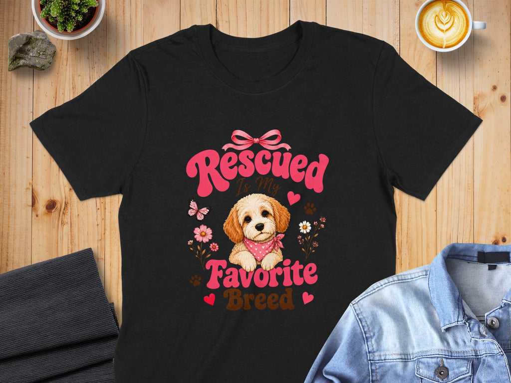 Black t-shirt with "Rescued Is My Favorite Breed" and a cute dog graphic.