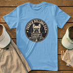 Light blue t-shirt with a circular graphic of a French bulldog and text.