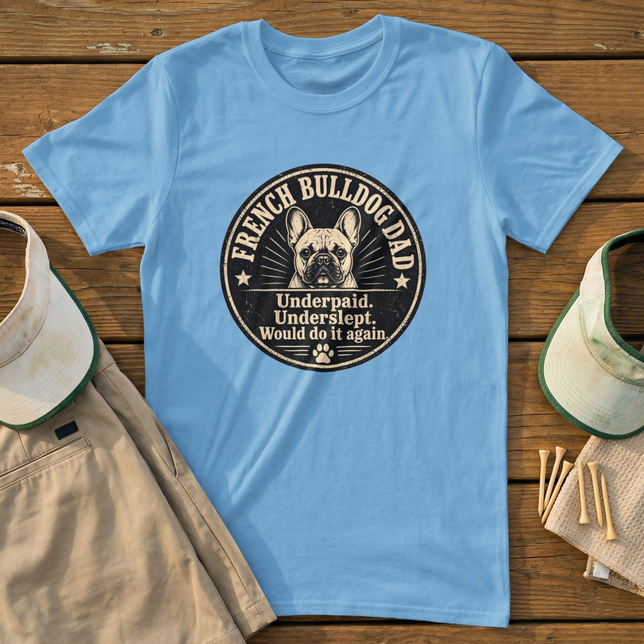 Light blue t-shirt with a circular graphic of a French bulldog and text.