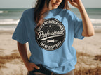 Blue t-shirt with black circle logo: "Golden Retriever Owner Professional Treat Dispenser"