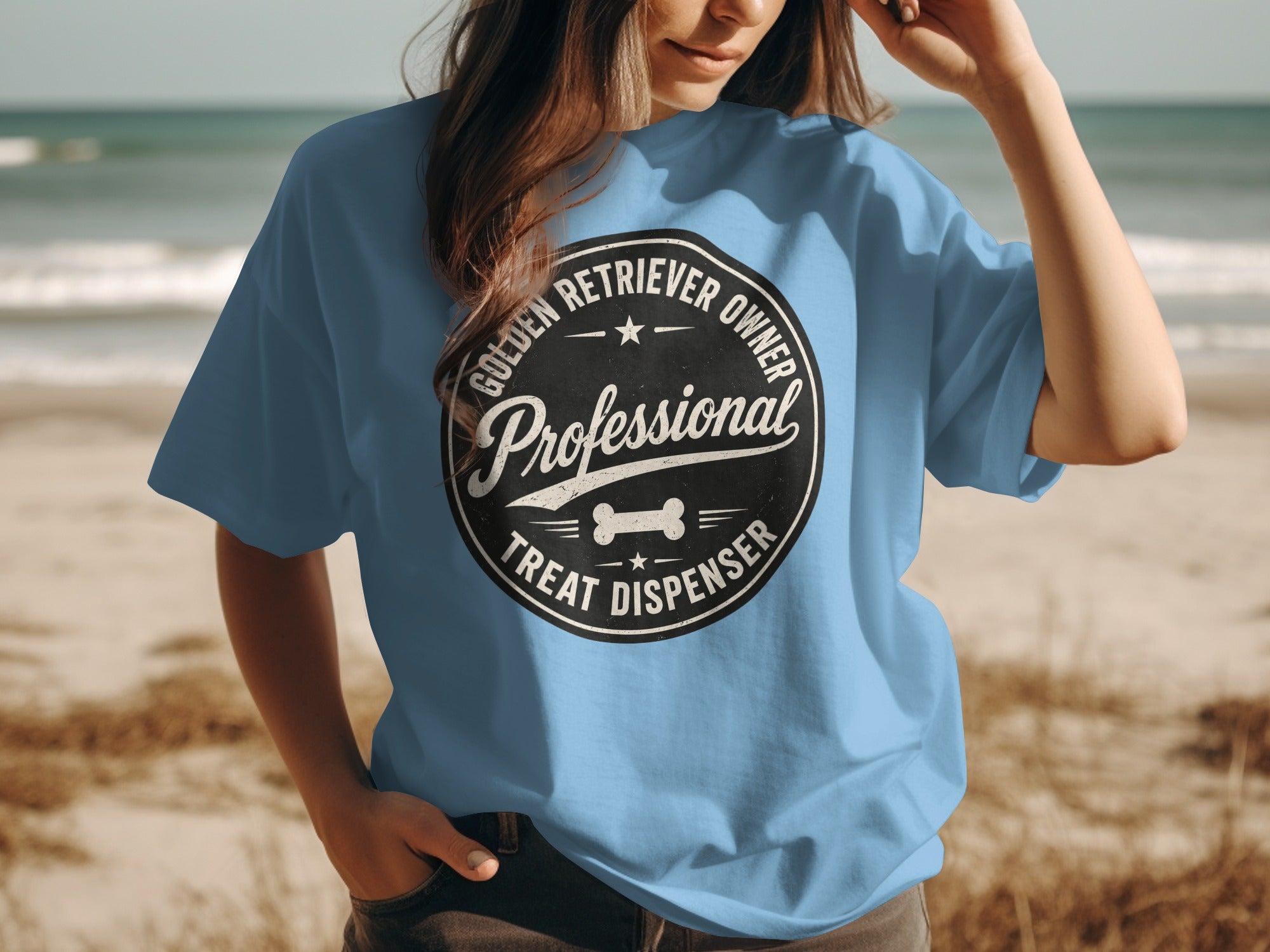 Blue t-shirt with black circle logo: "Golden Retriever Owner Professional Treat Dispenser"