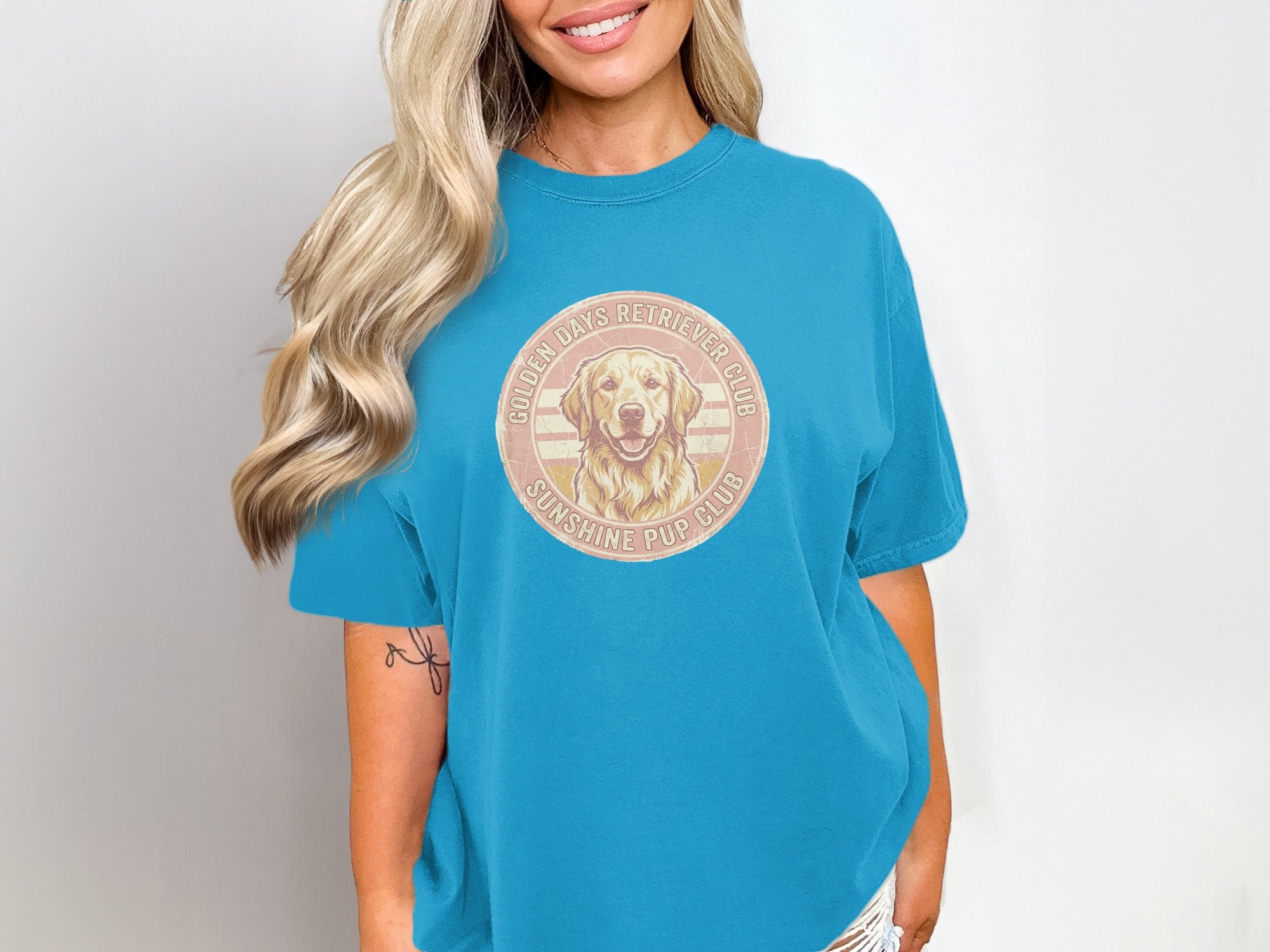 Blue t-shirt with Golden Retriever Club Sunshine Pup Club graphic.