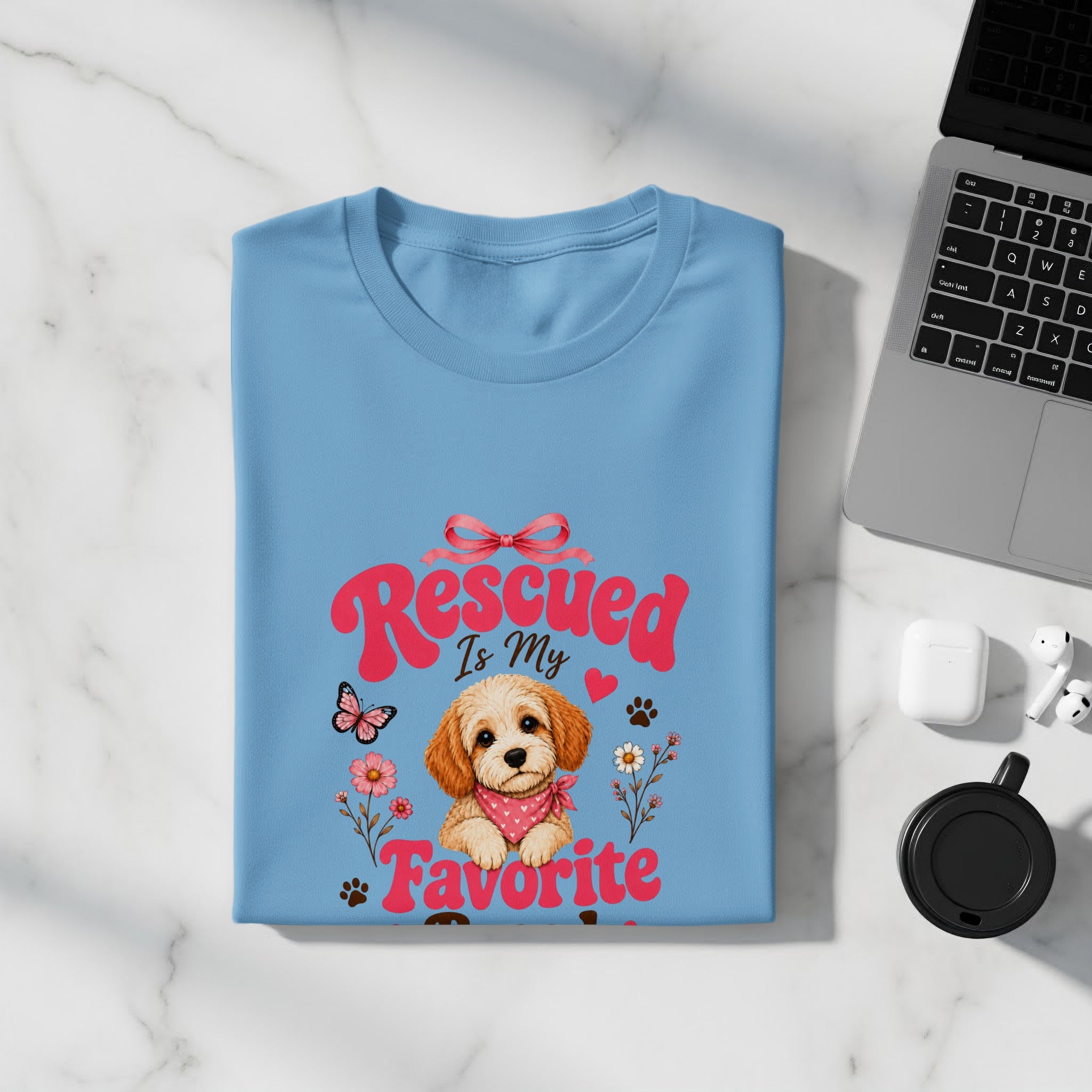 Light blue t-shirt with "Rescued is My Favorite" and dog graphic.