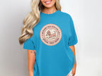 Dachshund Treat Inspector Club Official Treat Patrol circular logo on a teal t-shirt.
