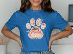 Blue t-shirt with a floral dog paw print design saying "Dog Mom".