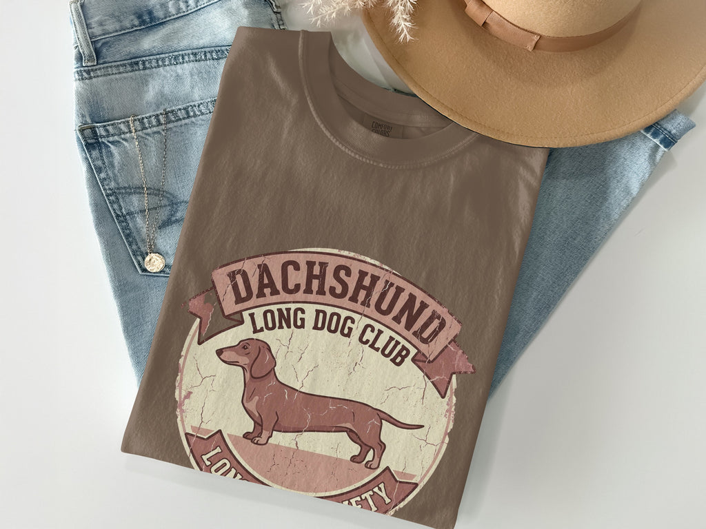 Brown t-shirt with Dachshund Long Dog Club logo featuring a dog silhouette.