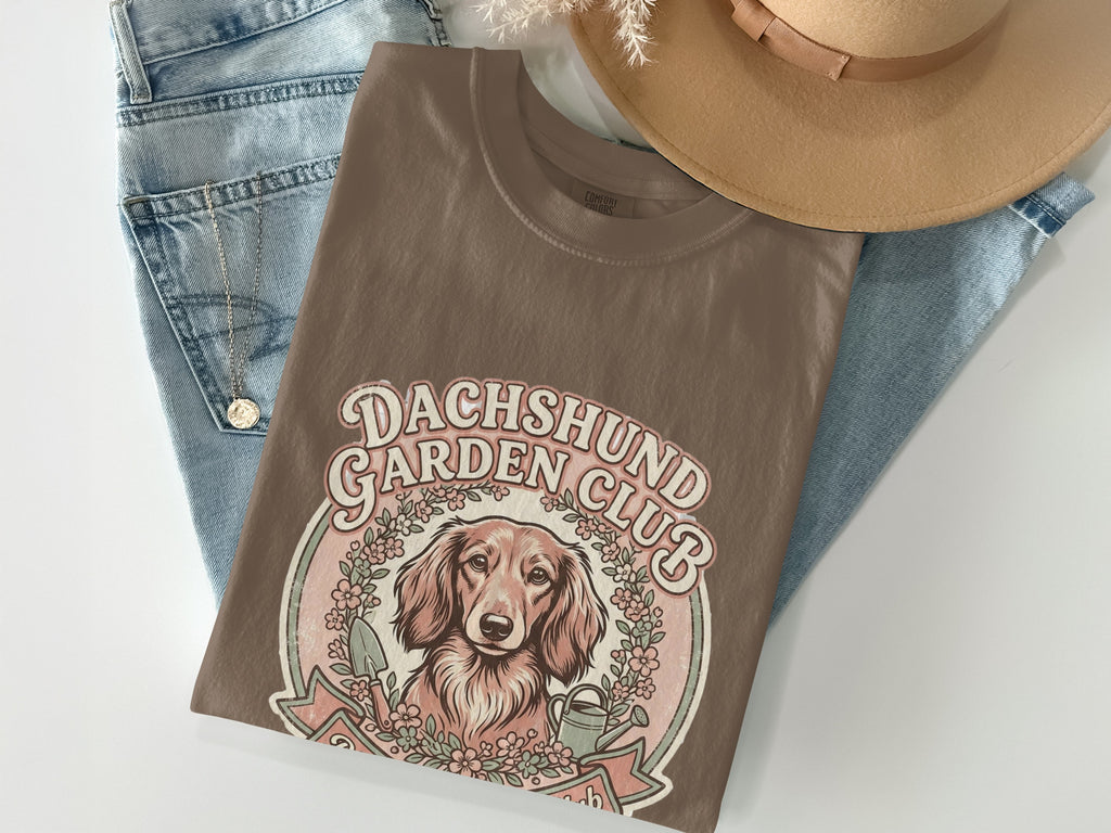 Brown t-shirt with Dachshund Garden Club graphic featuring a dog and floral wreath.